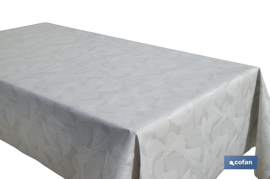 Mantel resinado antimanchas | Diseño moderno con hojas | Color: gris y blanco | Materiales: algodón y poliéster | Disponible en